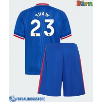 Fotballdrakt Barn Manchester United Luke Shaw #23 Bortedraktsett 2026-27 Kortermet (+ Korte bukser)